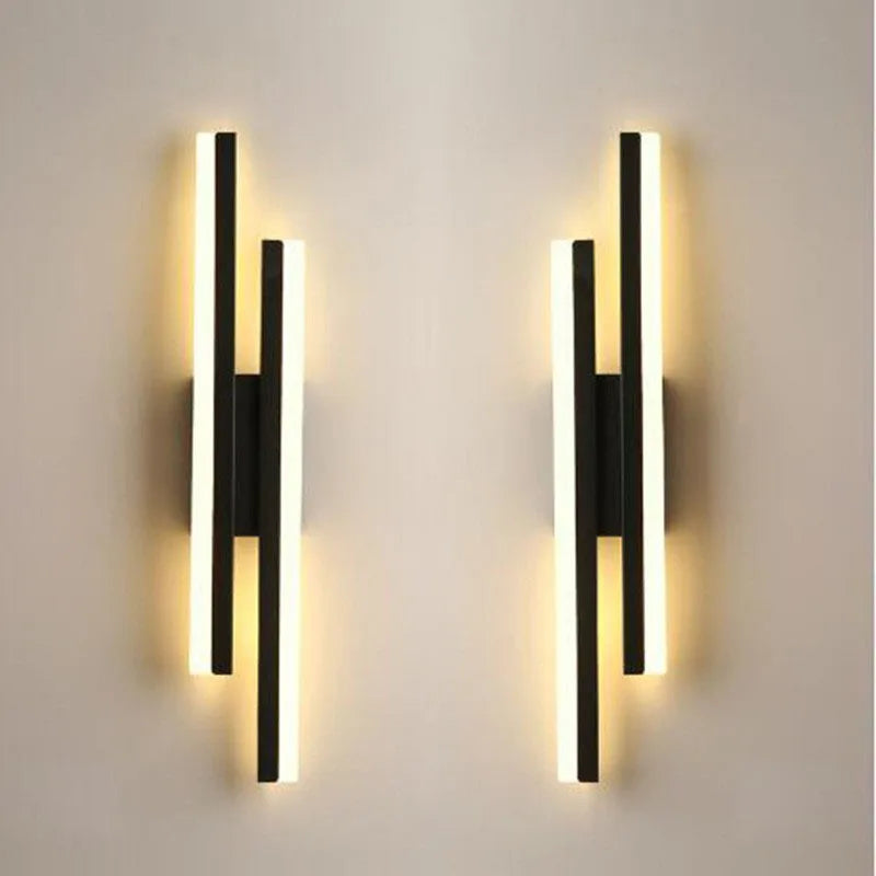 LED copper pipe wall lamp with acrylic shade on a living room wall